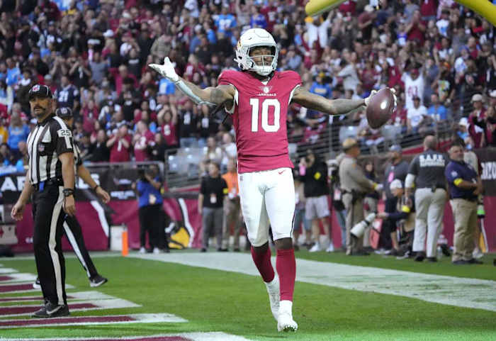 Arizona Cardinals wide receiver DeAndre Hopkins puts his hands out to the side in celebration